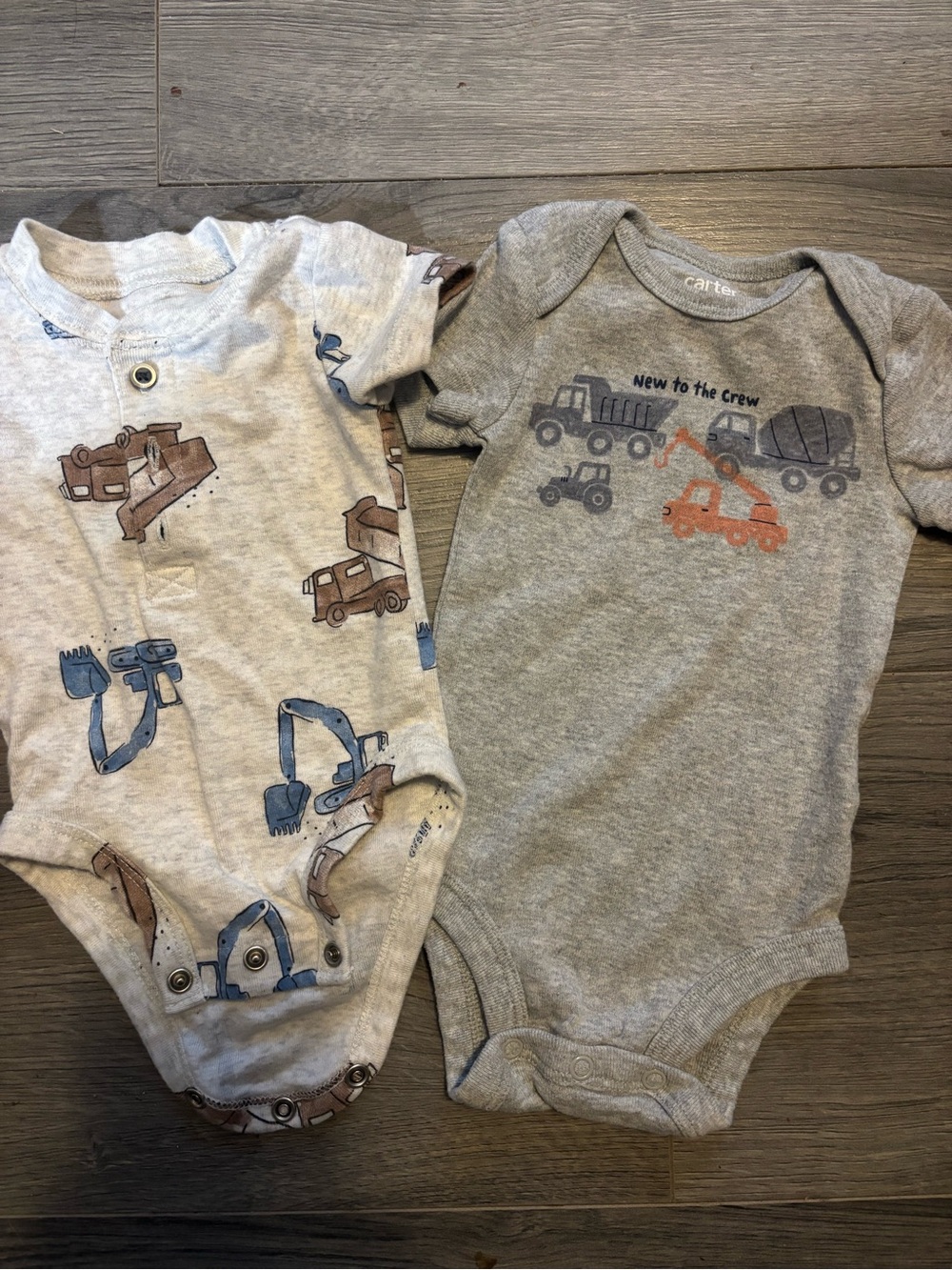 2 Carter's onesies with Construction Vehicles